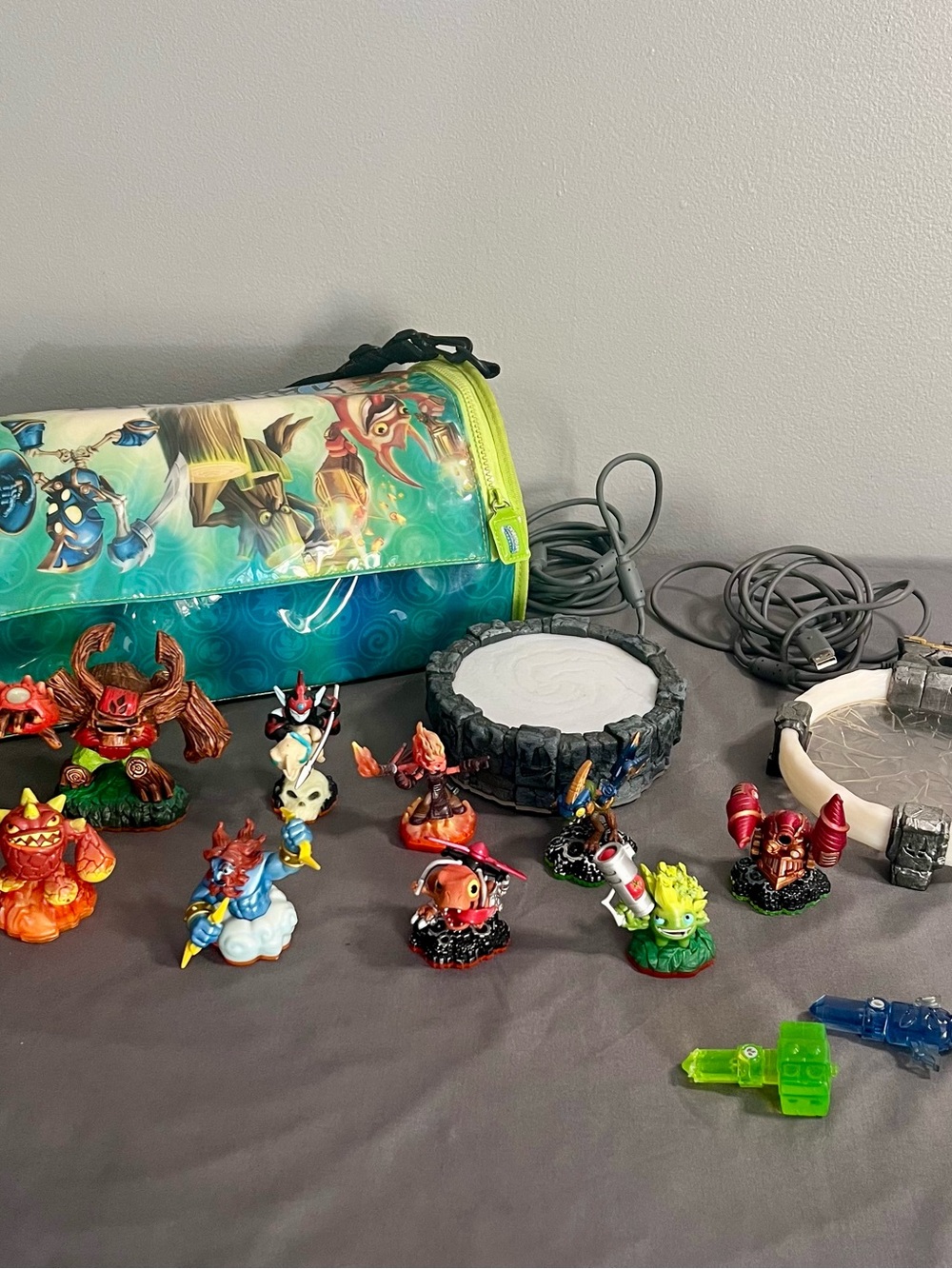 Skylanders Starter Lot Of 9 Figurines, 2 Portals, A Portable Bag, & 2 Weapons